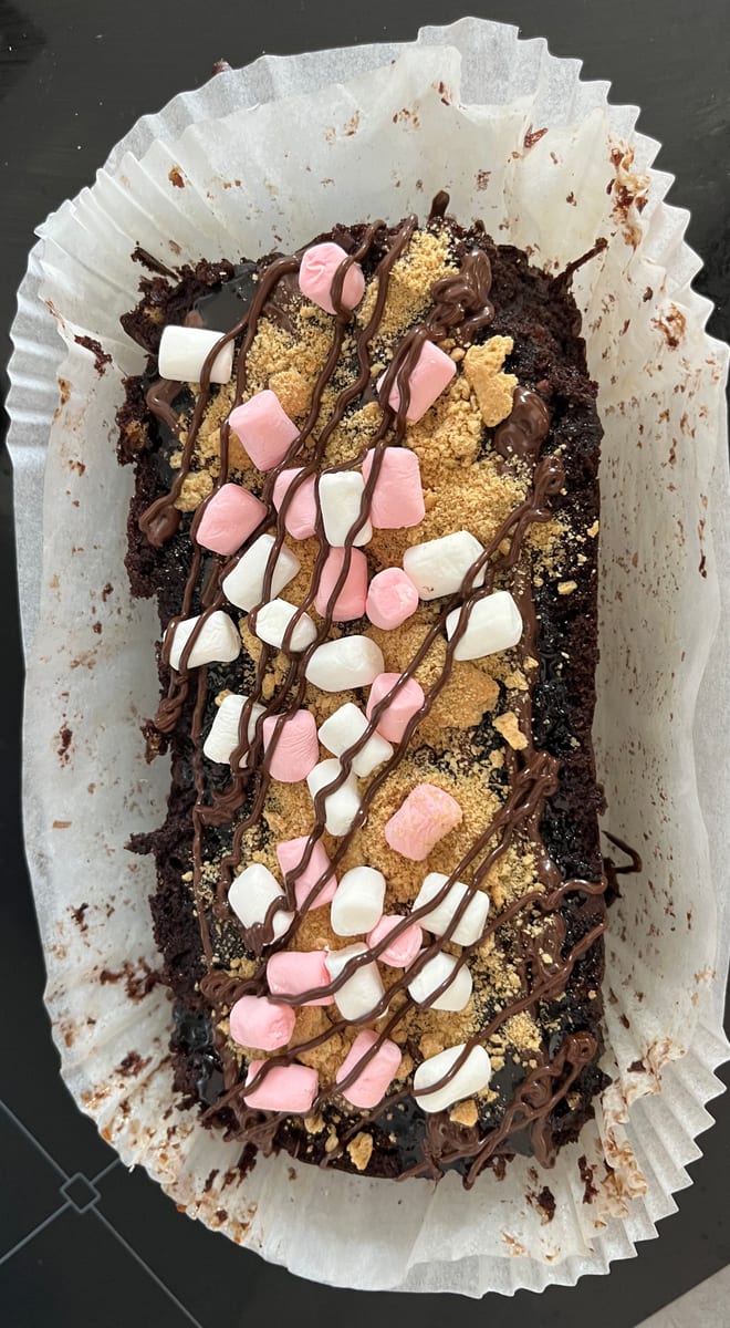 S'mores loaded brownie loaf topped with toasted marshmallows
